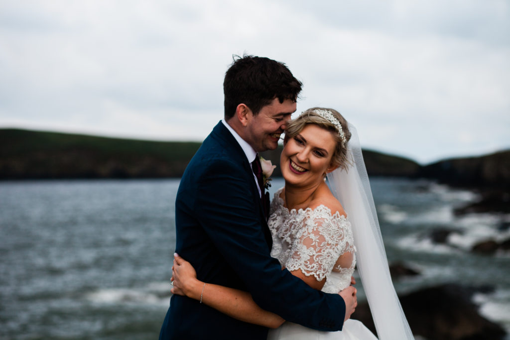 wedding in the rain, happy couple, the cliff hotel and spa, rainy seaside wedding couple, 