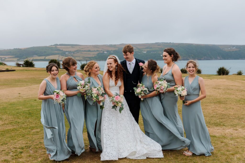 Wedding party group photo, costal background with wedding group shot,