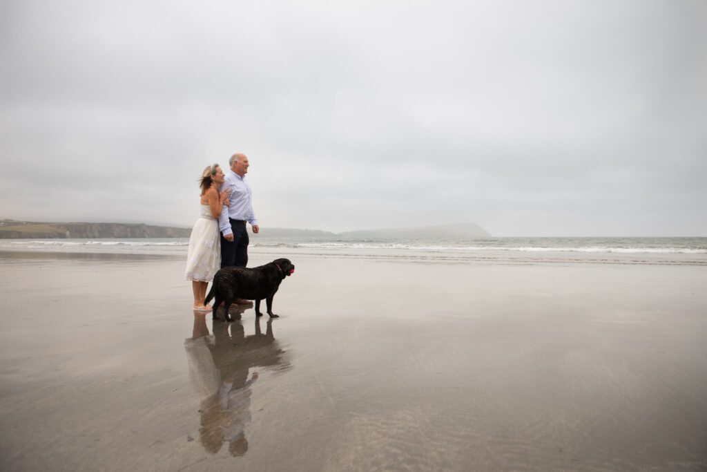 Newport pembrokeshire wedding elopement, elopement photo on the beach, wedding couple eloping with their dog, 