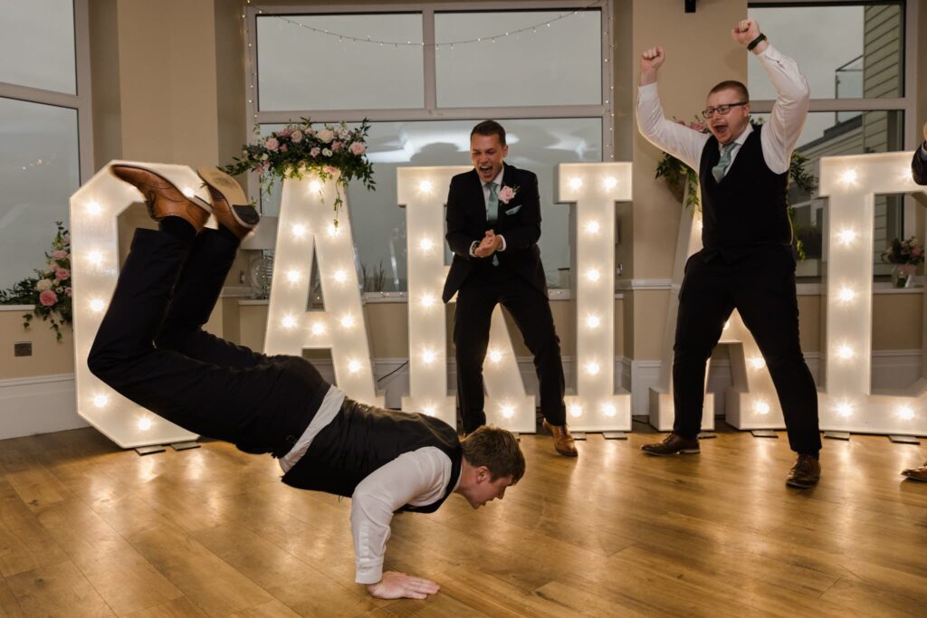 Groom dancing the worm at the cliff hotel and spa,
