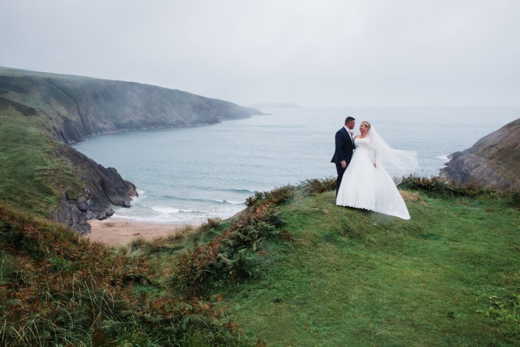 wedding elopement at mwnt, wedding couple with sea views in the background, 