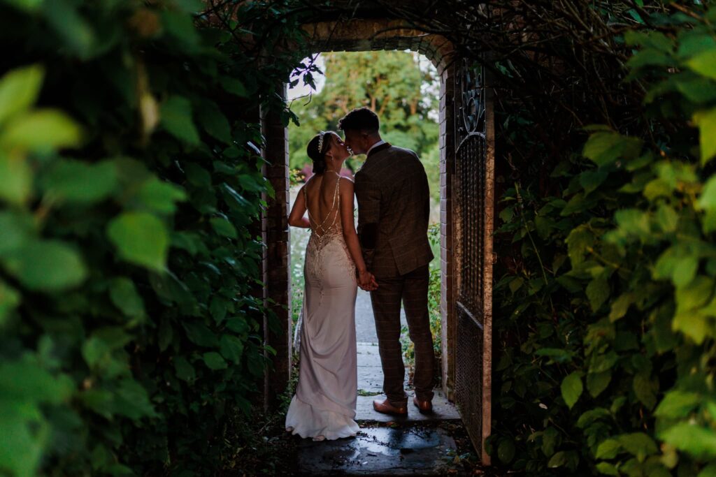 Wedding couple in the archway at rhosygilwen, wedding couple, 