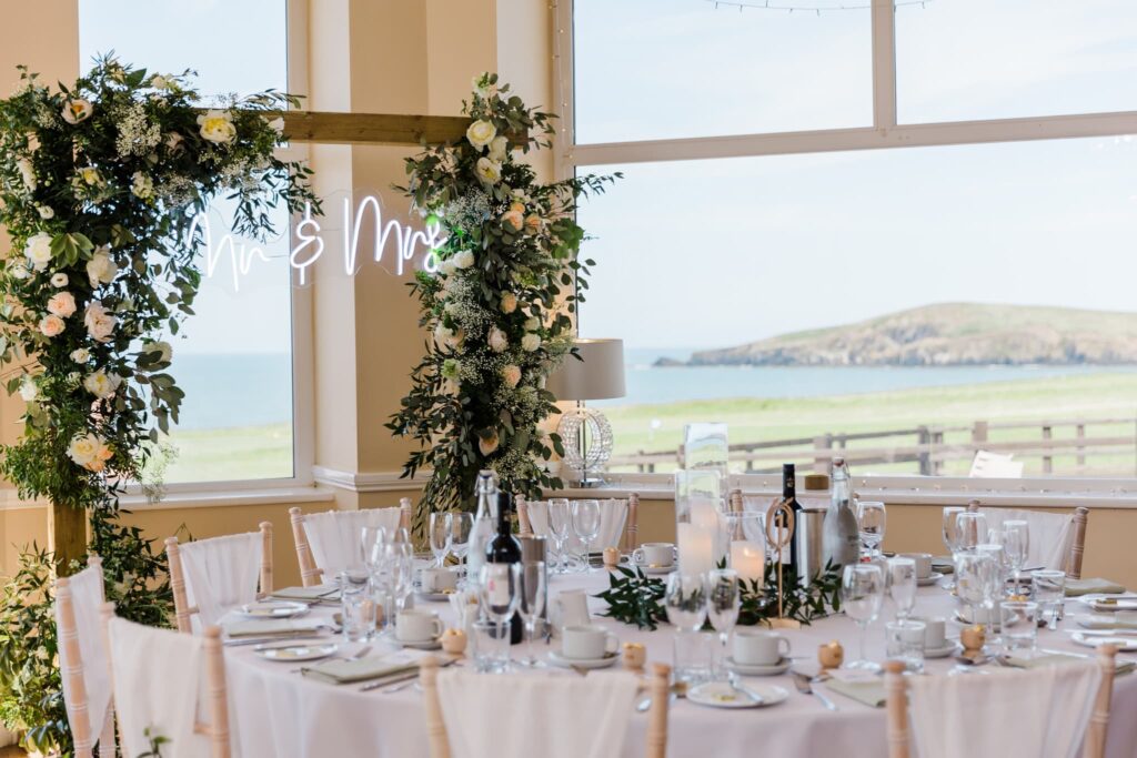 the cliff hotel and spa indoor reception, Mr and Mrs LED sign, Wedding table dressed,