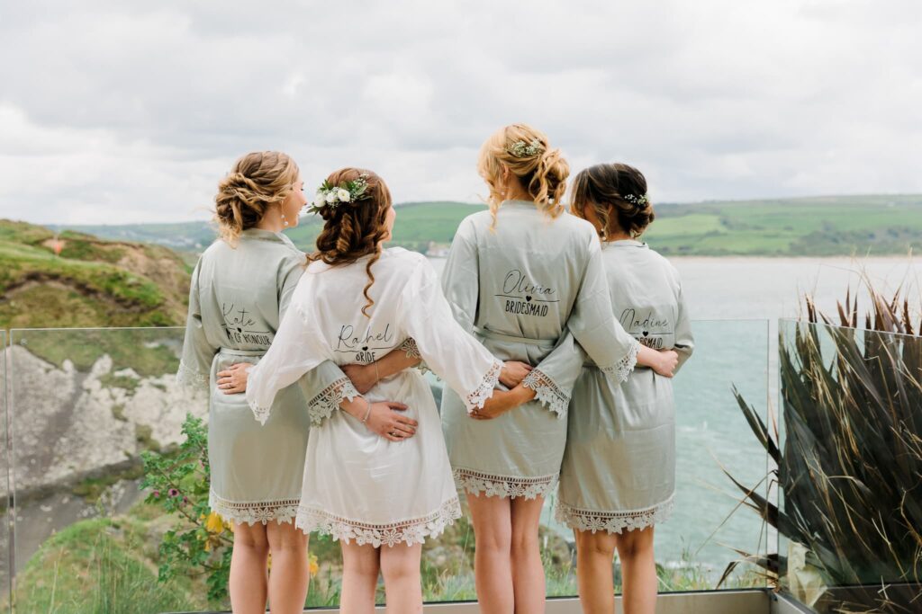 bridal party before the wedding, bridal party looking out to the sea views,