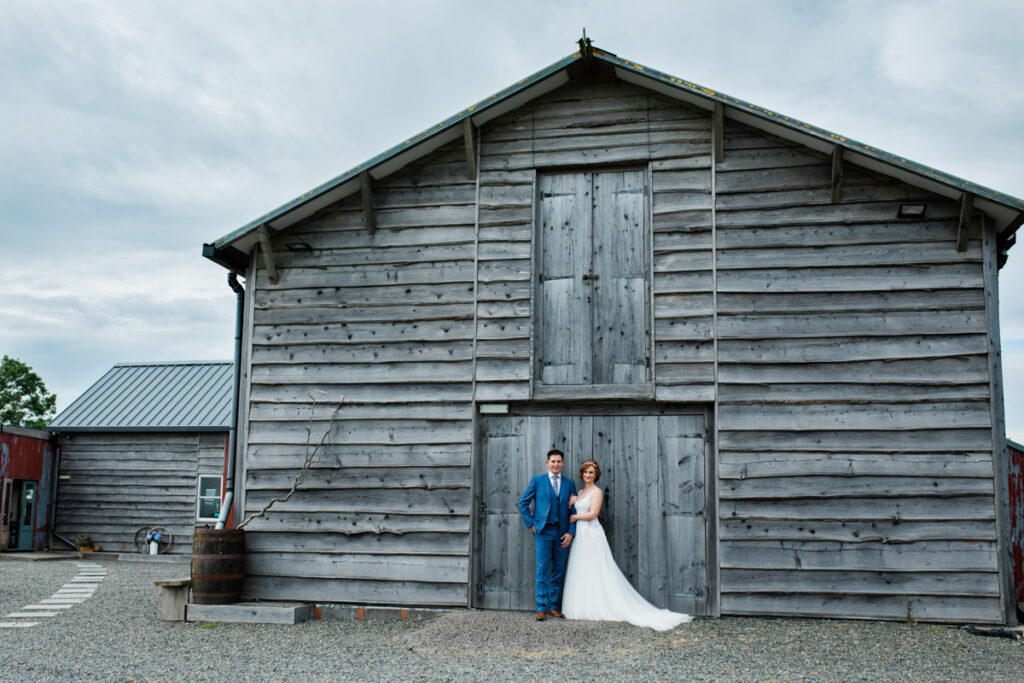 Woodhouse barn, Wedding couple in front of Woodhouse barn in rosebush, Pembrokeshire wedding Venue, 